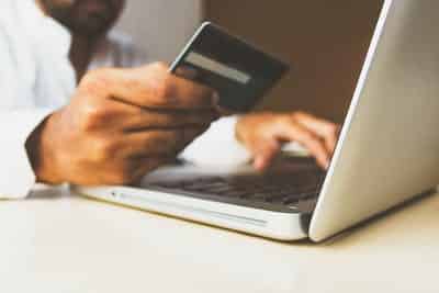 person making an online payment with a credit card