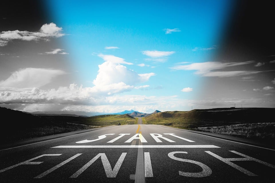start and finish written on a road